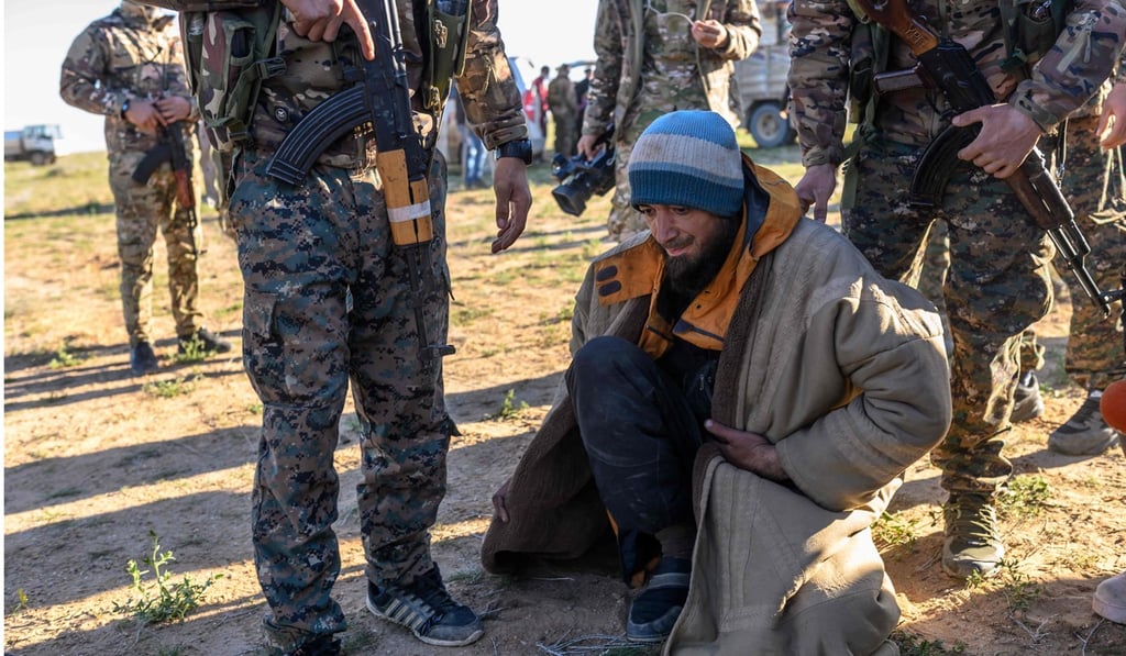 File photo of Syrian rebels capturing a man from Bosnia suspected of being an Islamic State fighter. Photo: AFP