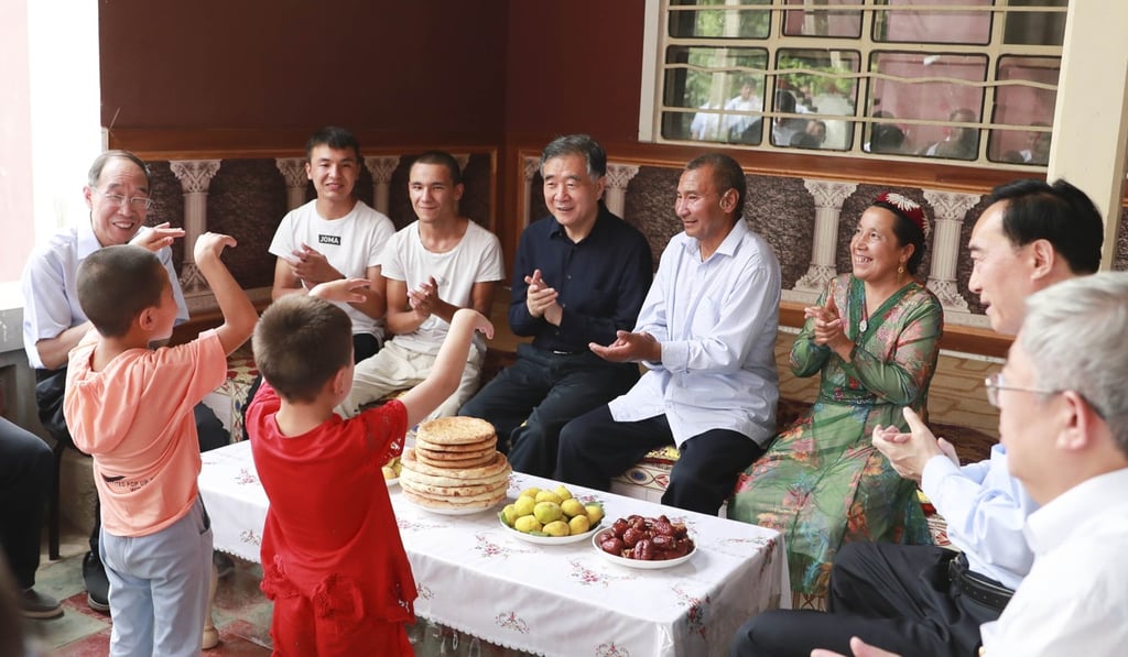 Wang Yang (centre) visits Xinjiang province, where he oversees affairs. Photo: Xinhua Wang Yang (centre) visits Xinjiang province, where he oversees affairs. Photo: Xinhua