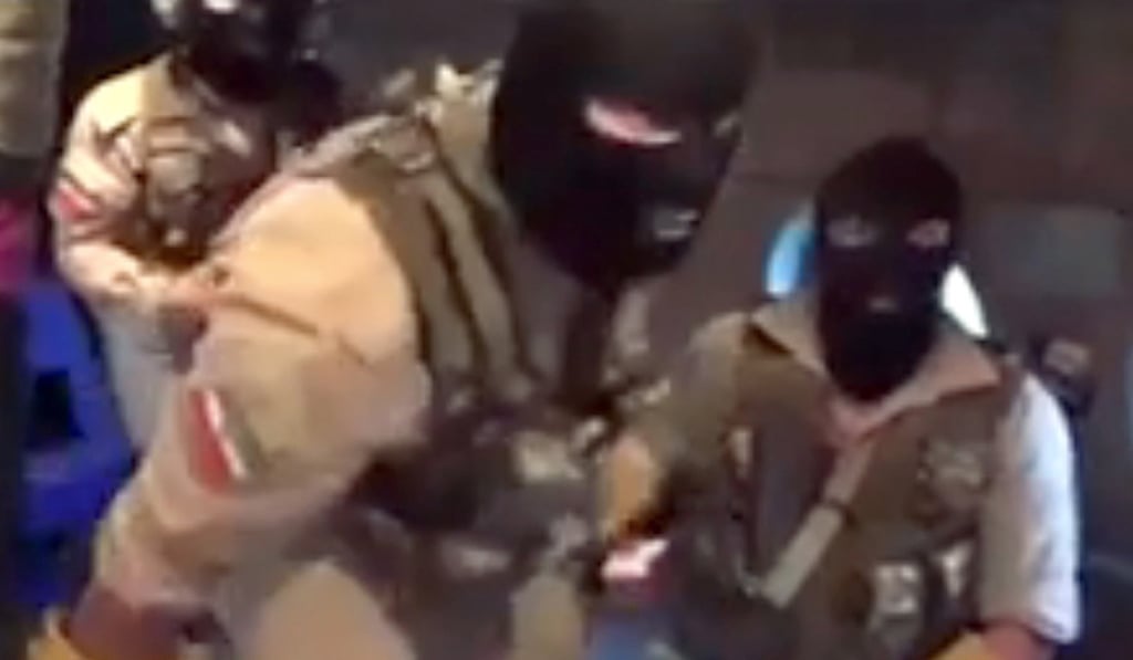 Iranian troops clad in balaclavas descended down a rope from a helicopter onto the vessel. Photo: EPA