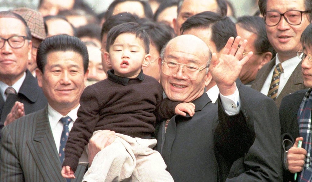 Former South Korean Presidnt Chun Doo-hwan, holding his grandson, pictured in 1997. Photo: AP