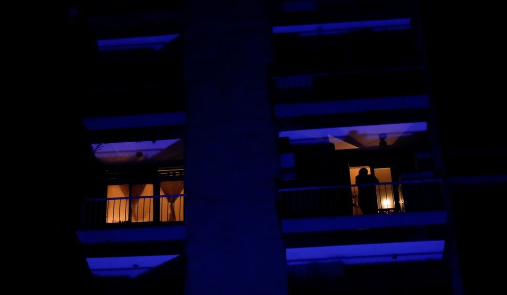 A man stands at the balcony of his flat in Caracas during the power cut. Photo: Reuters A man stands at the balcony of his flat in Caracas during the power cut. Photo: Reuters