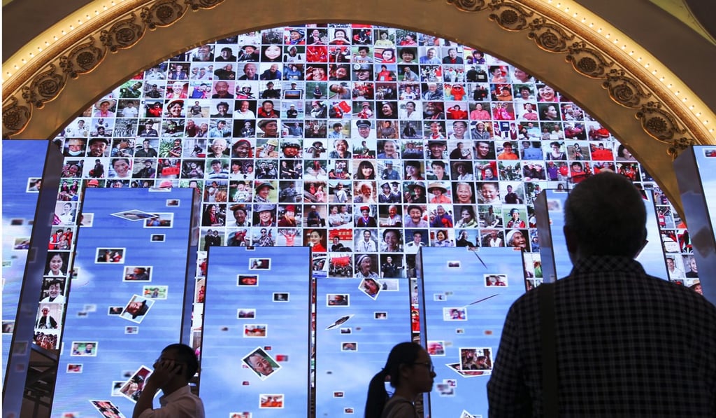 Photos showing smiling faces of Chinese people displayed previously at an exhibition in Beijing to highlight Communist Party achievements. Photo: Simon Song