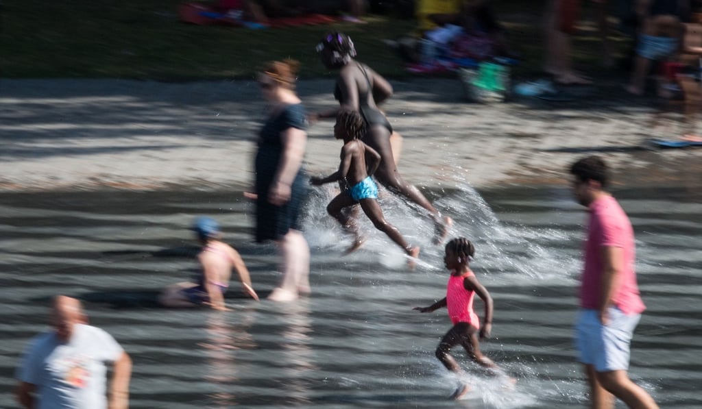 Children run through water as they enjoy the Water Mirror (Mirroir d’Eau) during a heatwave in Nantes, France on Wednesday. Photo: AFP Children run through water as they enjoy the Water Mirror (Mirroir d’Eau) during a heatwave in Nantes, France on Wednesday. Photo: AFP