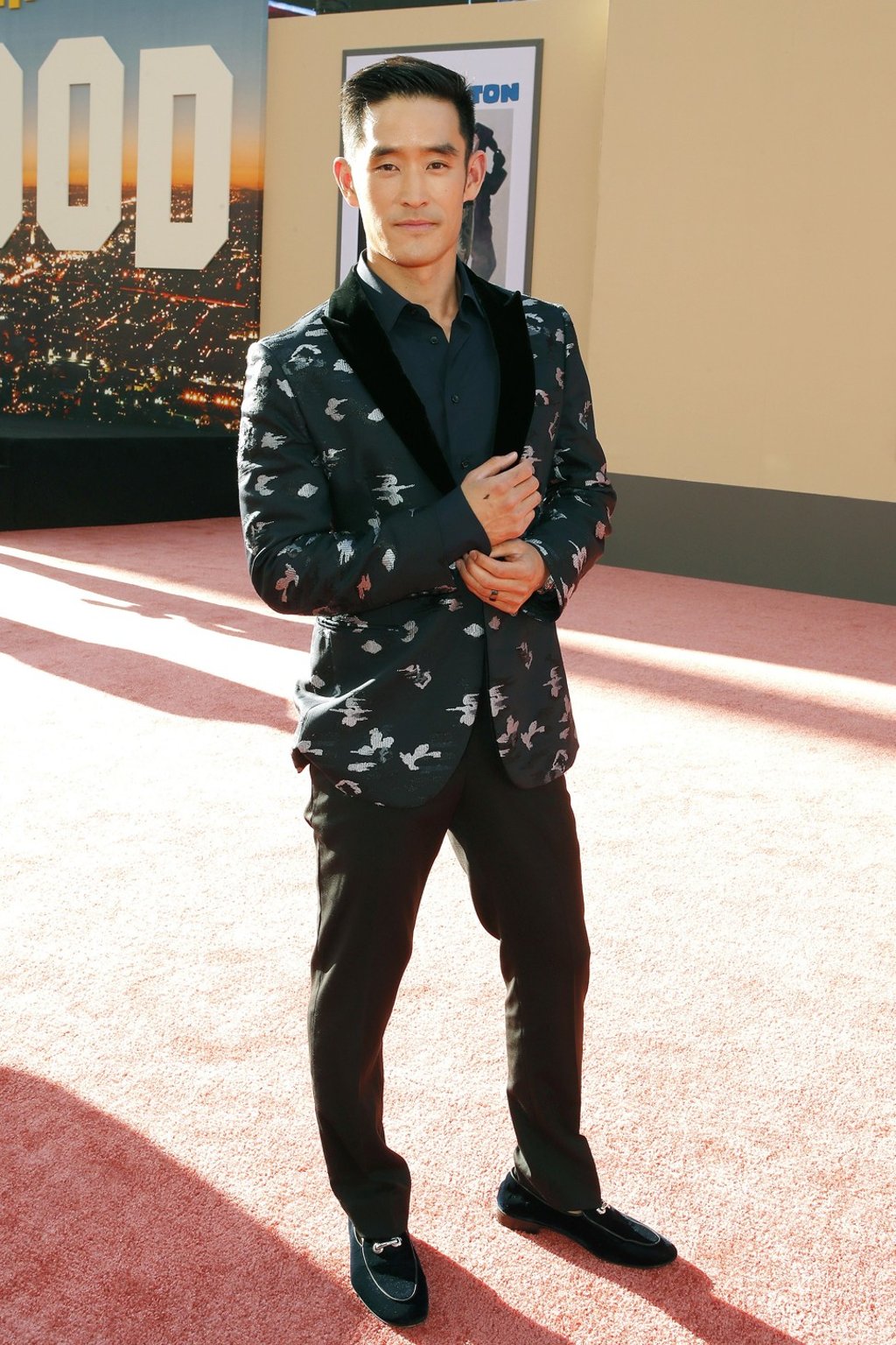 Mike Moh, who plays martial arts legend Bruce Lee in the Quentin Tarantino-directed film, wears Emporio Armani on the red carpet. Photo: EPA