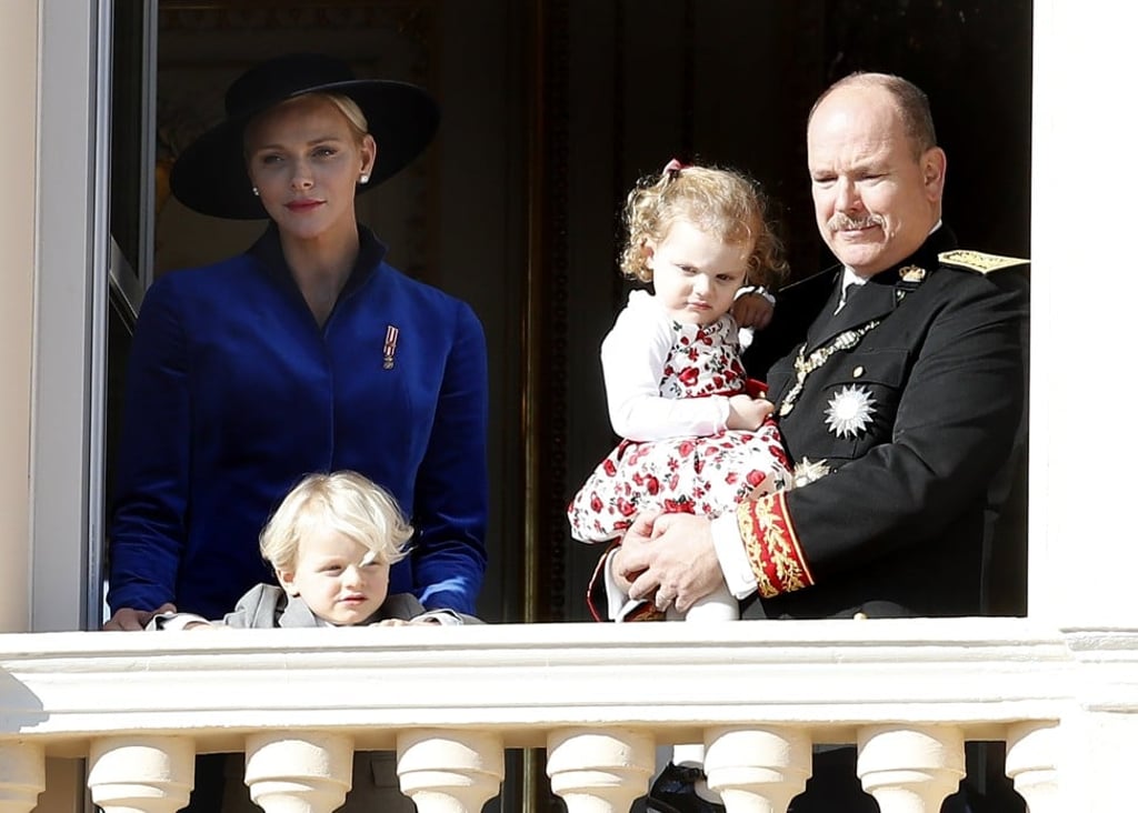 Princess Charlene (left) and her husband, Prince Albert II of Monaco (right) with his wife Princess Charlene and their twin children, Prince Jacques (front) and Princess Gabriella, as they watch a parade during Monaco’s National Day in 2017. Photo: EPA-EFE