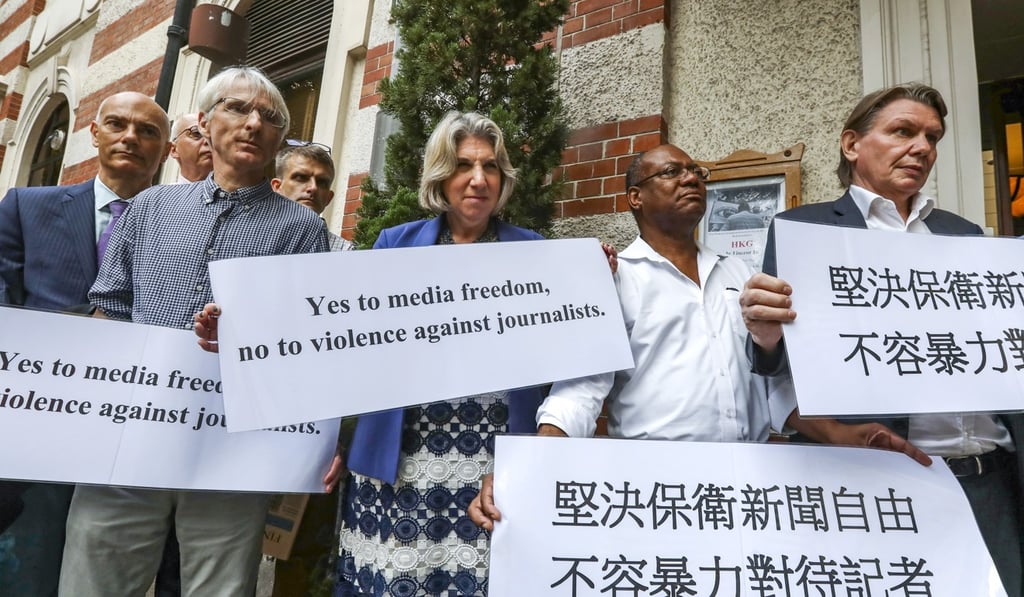 Members of the Foreign Correspondents’ Club stage a silent protest outside the club building in Central on July 23 to defend press freedom and fight violence against journalists during the recent anti-extradition bill protests. Photo: Nora Tam