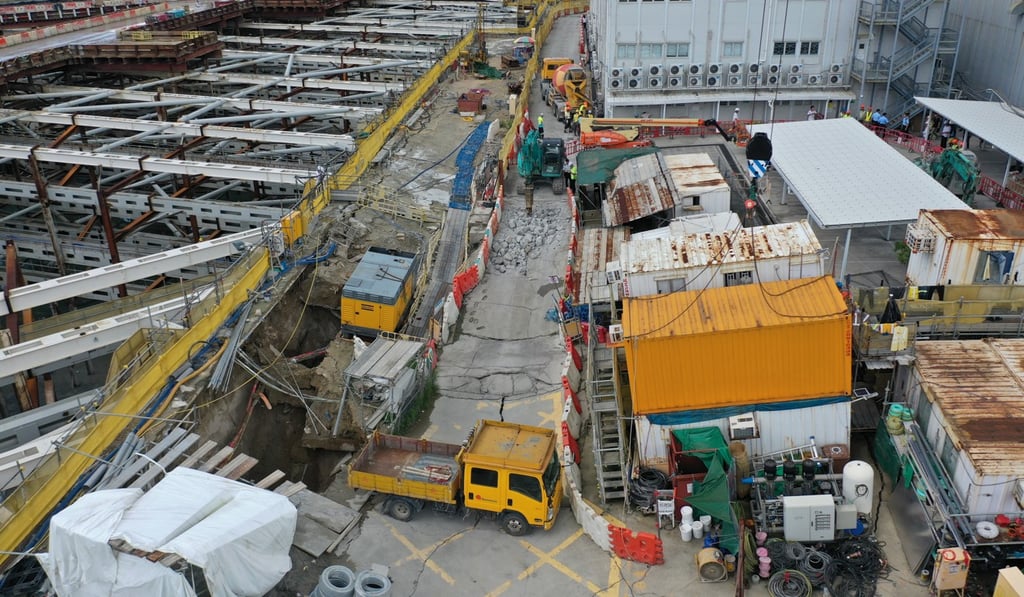 A sinkhole and tilted cargo containers and structures were caused by flooding at the West Kowloon Cultural District. Photo: Winson Wong
