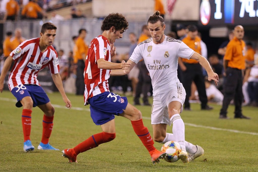 Gareth Bale takes on Atletico Madrid forward Sergio Camello. Photo: USA TODAY Sports