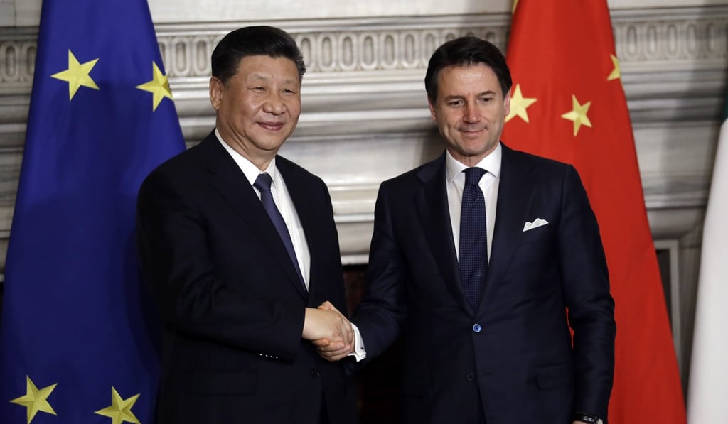 Italian leader Giuseppe Conte shakes hands with Chinese President Xi Jinping after the signing of a deal on the belt and road plan in Rome in March. Photo: AP
