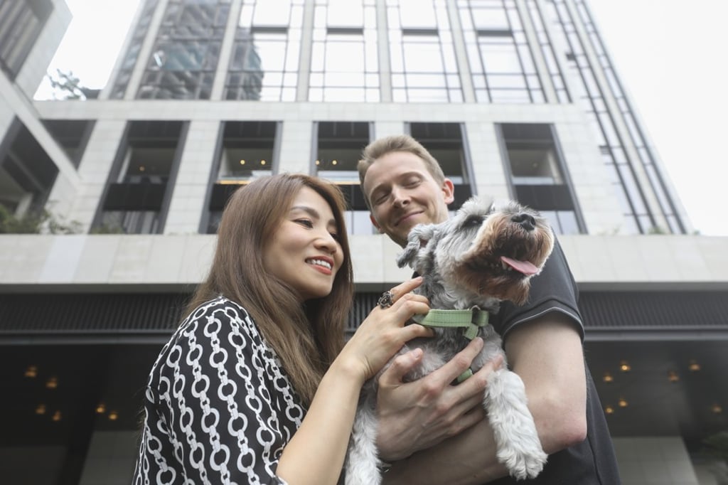 Colin with his owners, Alice and Tom Eves, outside the Rosewood Hong Kong. Photo: Antony Dickson