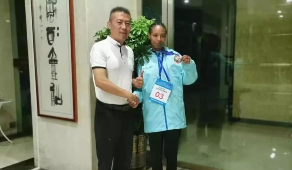 Ethiopia’s Alemaz Negede is visited by one of the organisers in her hotel.