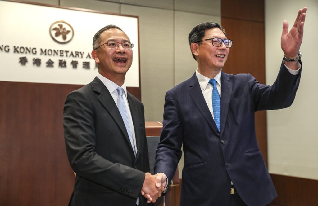 HKMA chief executive Norman Chan (right) will be succeeded by Eddie Yue (right) as head of the city’s de facto central bank from October 1. Photo: Nora Tam
