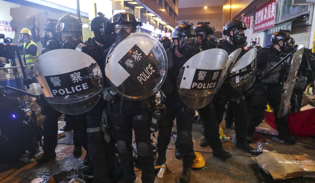 Riot police prepare for action in Sheung Wan after tear gas is fired at anti-extradition bill protesters on July 28. Photo: Edmond So Riot police prepare for action in Sheung Wan after tear gas is fired at anti-extradition bill protesters on July 28. Photo: Edmond So