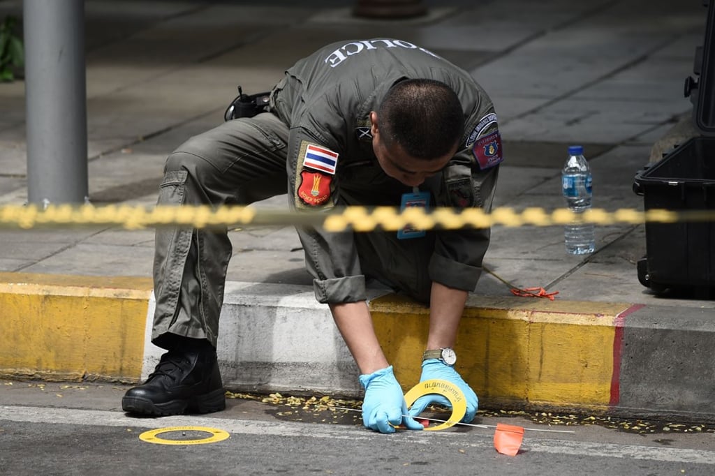 A policeman at the scene of an explosion in Bangkok. Photo: AFP