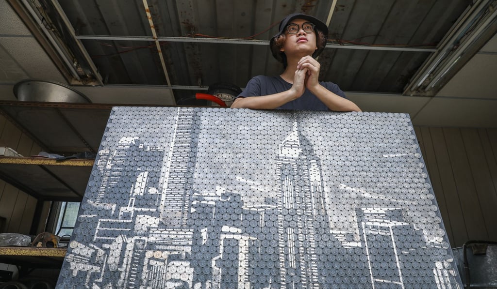 Giraffe Leung uses HK$1 coins to recreate the skyline of the moneyed Central district. Photo: Nora Tam
