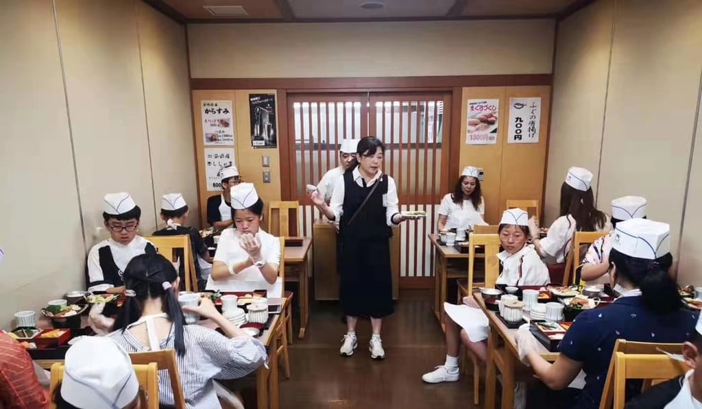 Learning to make sushi during a study tour of Japan in July. Photo: East Meets West