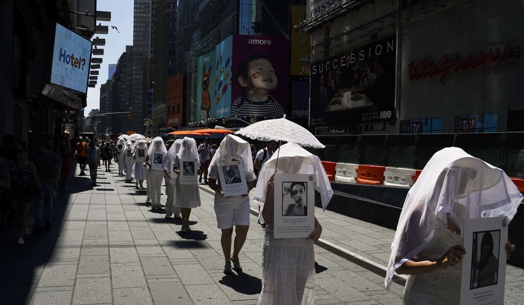 Protesters against gun violence dressed in white clothe march in Times Square in response to recent mass shootings in El Paso, Texas and Denton, Ohio, on Sunday in New York City. Photo: AFP Protesters against gun violence dressed in white clothe march in Times Square in response to recent mass shootings in El Paso, Texas and Denton, Ohio, on Sunday in New York City. Photo: AFP