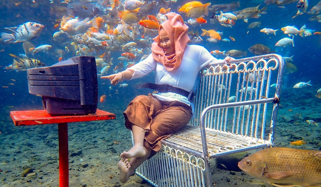 People flock to Umbul Ponggok in Indonesia to take pictures of themselves in funny poses underwater. Photo: James Wendlinger