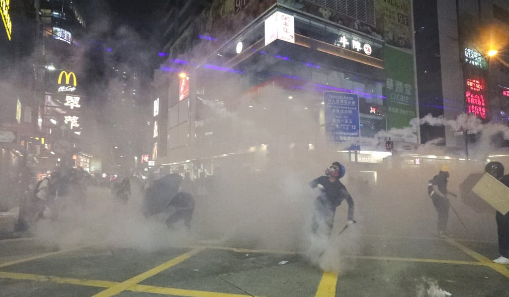 Riot police officers clash with anti-extradition bill protesters at Causeway Bay on August 4. Photo: Felix Wong