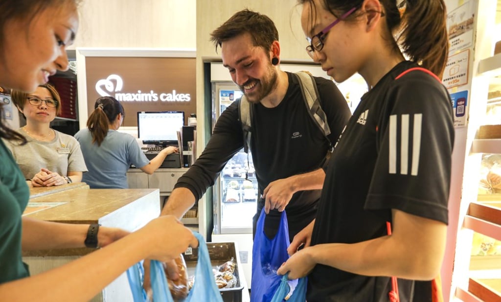 Marlow collects unsold food from a bakery in Kennedy Town. Photo: Tory Ho