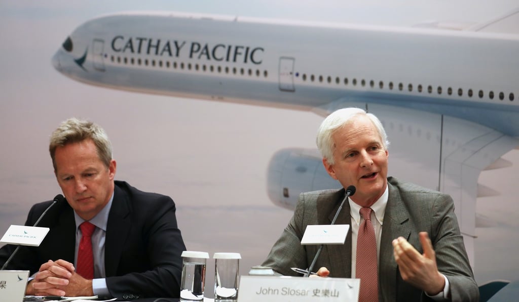 Cathay Pacific CEO Rupert Hogg (left) and chairman John Slosar address a press conference to announce the company’s first-half results, on Wednesday. The company’s shares rose after it posted a profit. Photo: Xiaomei Chen