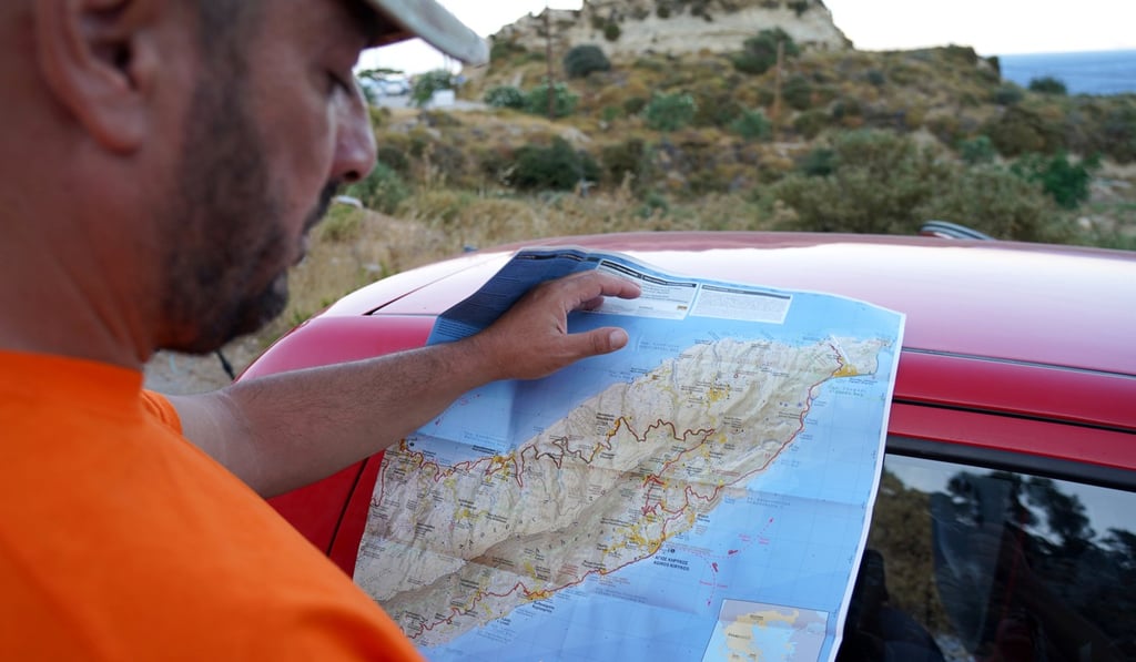 A volunteer rescuer reviewing a map of the area where the body of missing British scientist Natalie Christopher was found on the island of Ikaria, Greece, on Wednesday. Photo: Reuters