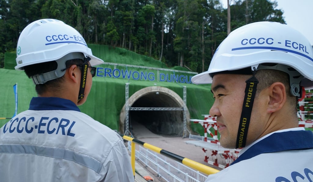 China Communications Constructions Limited workers stand in front of a tunnel of the East Coast Rail Link project in Terengganu. Photo: AFP