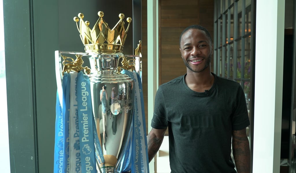 Raheem Sterling of Manchester City with the Premier League trophy in Hong Kong. Photo: Dayu Zhang