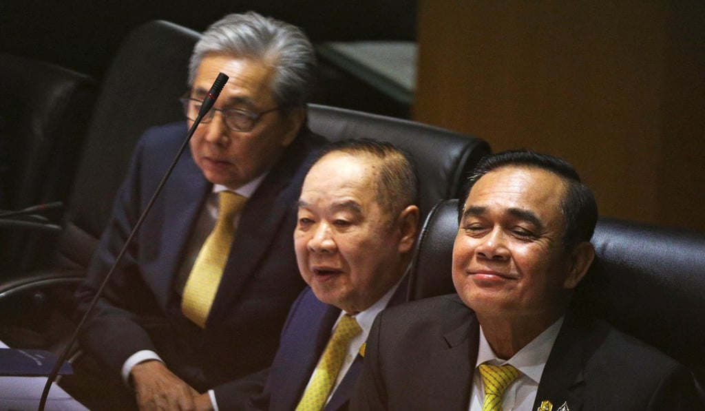 Prayuth Chan-ocha sits with members of his cabinet before delivering a policy statement in Bangkok on July 25. Photo: Reuters