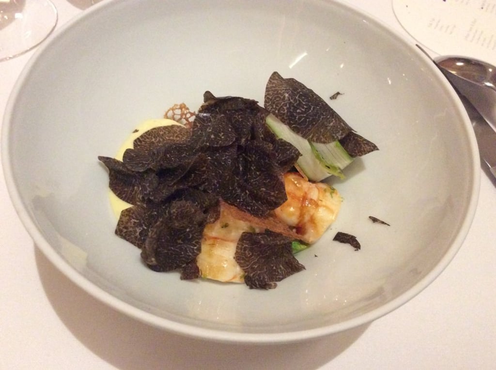 Mozambique langoustine tails with vin jaune sauce, stuffed morel mushrooms, wild asparagus and black truffles. Photo: Susan Jung