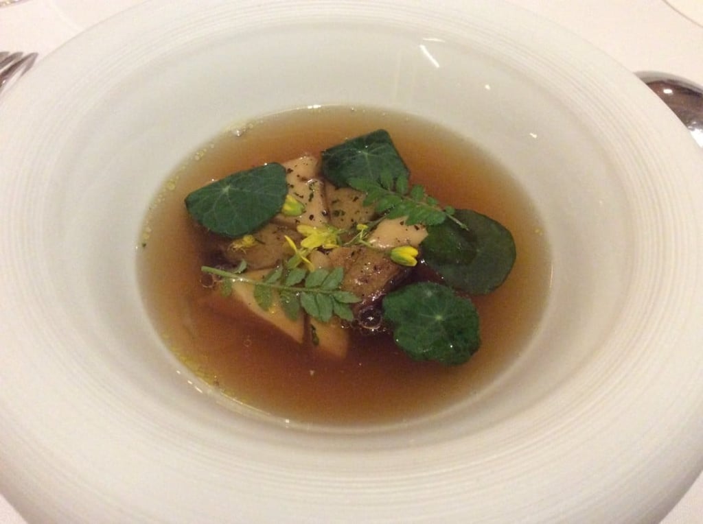 Poached foie gras in bouillon paysan with charred abalone and braised shiitake. Photo: Susan Jung