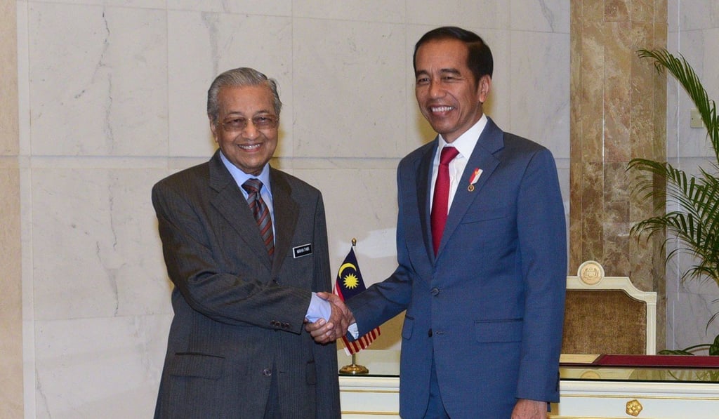 Malaysia's Prime Minister Mahathir Mohamad greets Indonesia's President Joko Widodo during his two-day visit to Malaysia. Photo: AFP