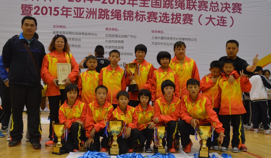 Lai Xuanzhi (left) with his coaching team and pupils at a national skipping competition in 2014. Photo: Lai Xuanzhi Lai Xuanzhi (left) with his coaching team and pupils at a national skipping competition in 2014. Photo: Lai Xuanzhi
