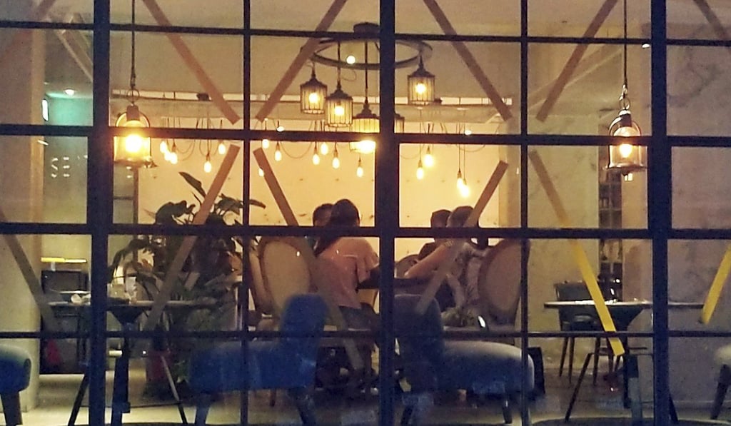 A restaurant in Taipei, Taiwan, prepares for Lekima with taped-up windows. Photo: AP A restaurant in Taipei, Taiwan, prepares for Lekima with taped-up windows. Photo: AP