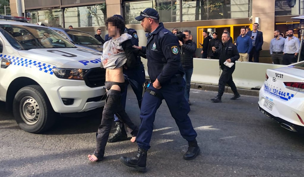 A man was taken into custody by police. Photo: Twitter