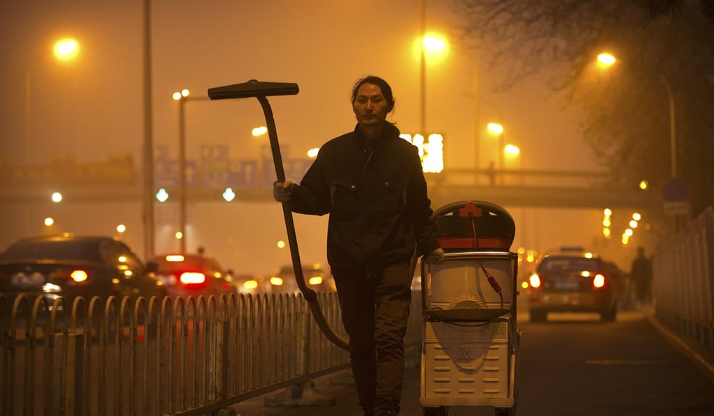 In 2015, Wang Renzheng spent four hours per day for 100 days vacuuming the Beijing air with an industrial shop-vac, then baked the accumulated dust and pollutants into a brick. Photo: AP