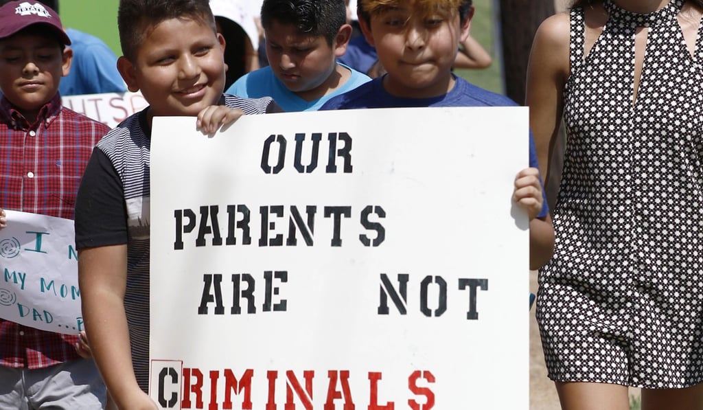 Children of mainly Latino immigrant parents hold signs on Sunday during a protest march to the Madison County Courthouse in Canton, Mississippi. Photo: AP