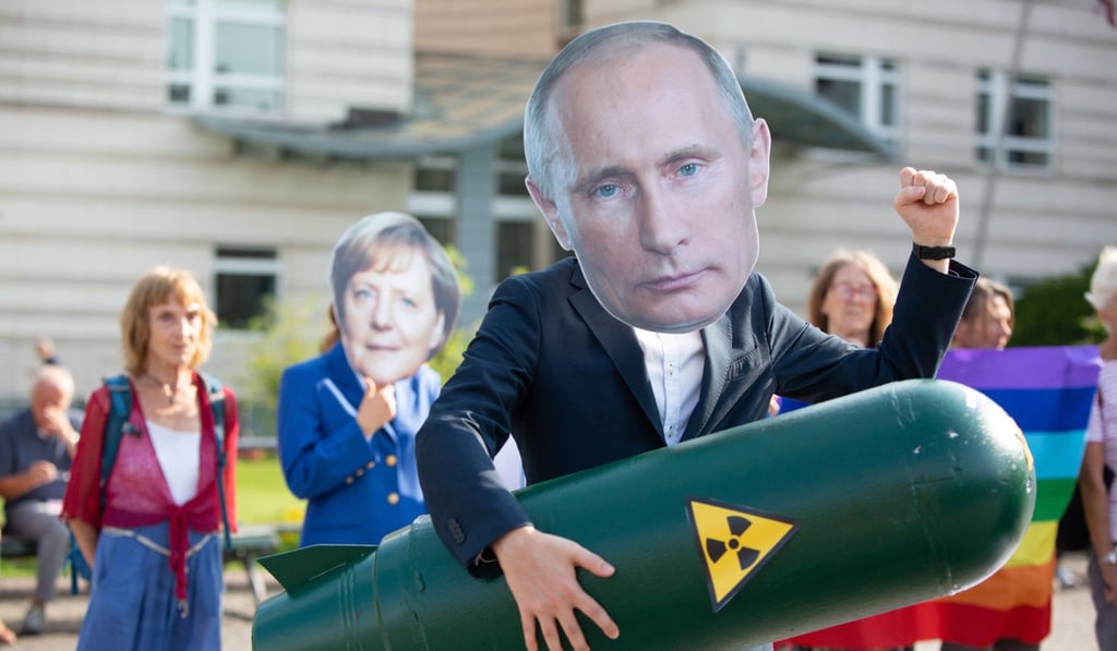 A German activist wears a Vladimir Putin mask as he holds a mock missile during a demonstration against the ending of the Intermediate-Range Nuclear Forces Treaty in front of the American Embassy in Berlin. Photo: EPA-EFE A German activist wears a Vladimir Putin mask as he holds a mock missile during a demonstration against the ending of the Intermediate-Range Nuclear Forces Treaty in front of the American Embassy in Berlin. Photo: EPA-EFE
