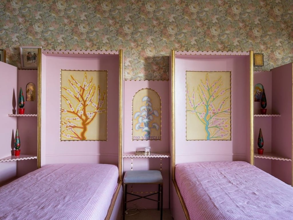 Across the four floors, there are 50 rooms and 20 bedrooms, some of which are also pink like the exterior of the lakeside home. Across the four floors, there are 50 rooms and 20 bedrooms, some of which are also pink like the exterior of the lakeside home.