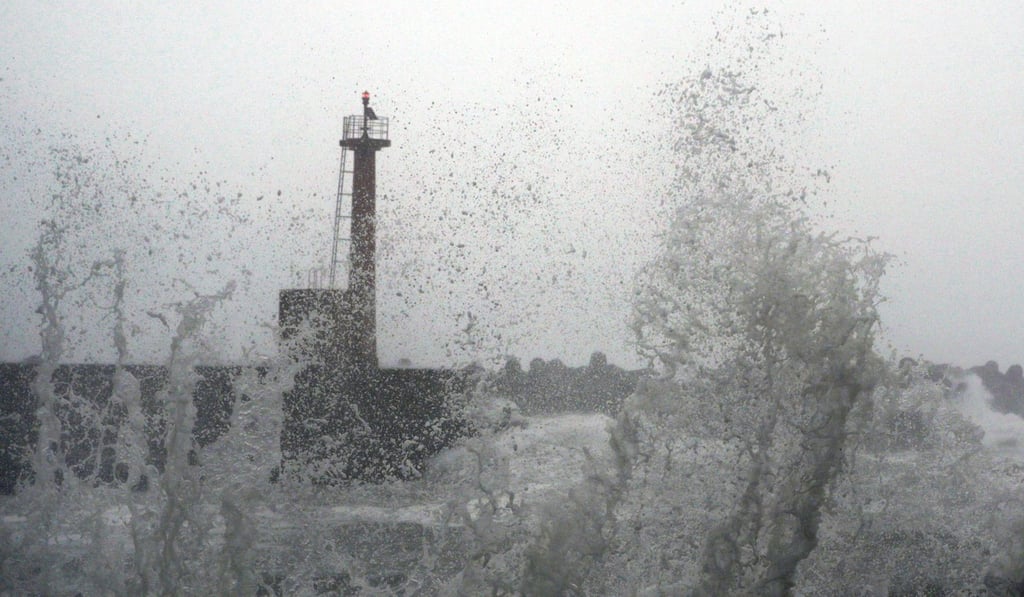 High waves smash into a fishing port in Muroto, Kochi Prefecture, west of Japan. Photo: Kyodo
