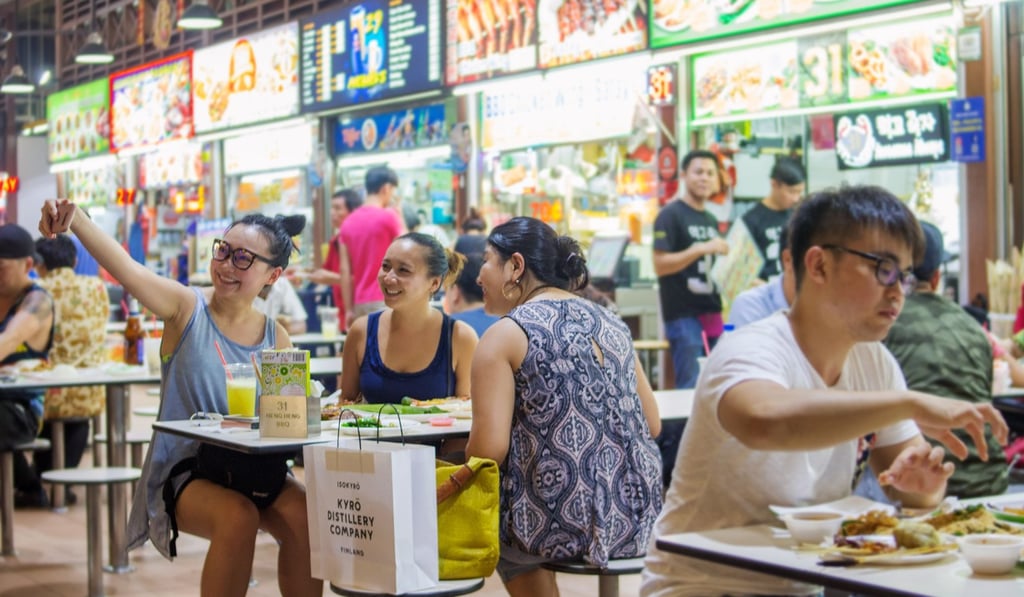 Friends gather at Singapore’s Newton Food Centre. Photo: Shutterstock
