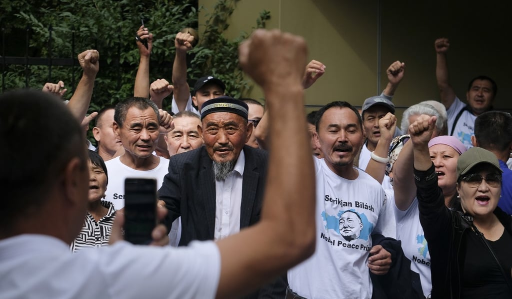 Supporters of Serikjan Bilash in front of a court building in Almaty, Kazakhstan, on Friday. Photo: AP Supporters of Serikjan Bilash in front of a court building in Almaty, Kazakhstan, on Friday. Photo: AP