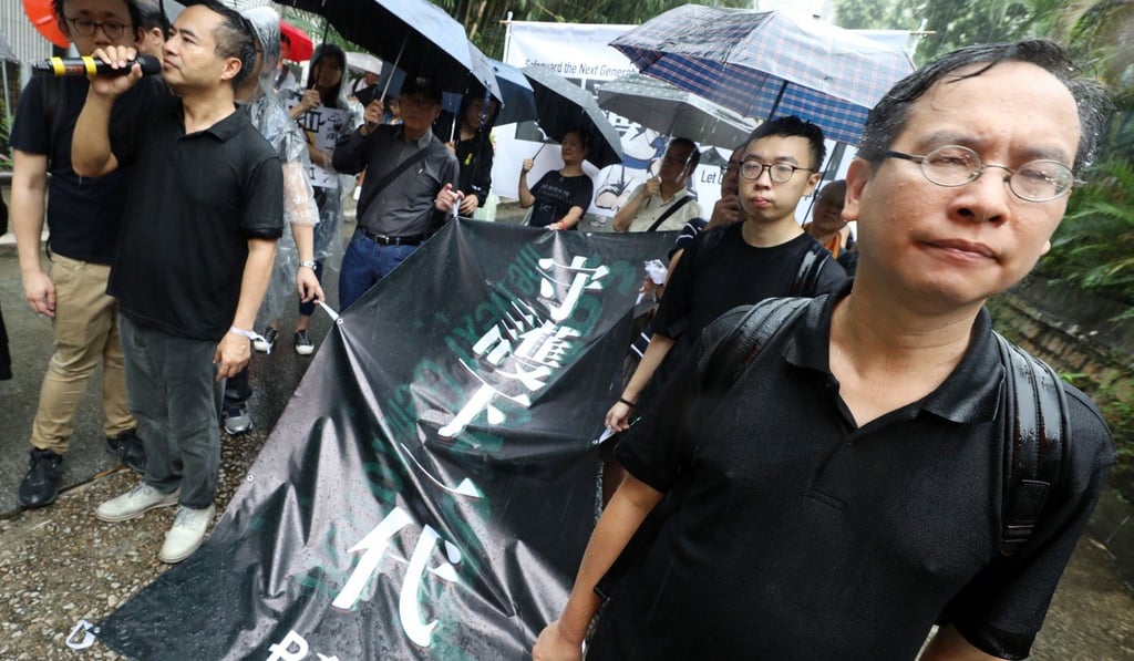 PTU president Fung Wai-wah (left in background) and vice-president Ip Kin-yuen. Photo: Dickson Lee