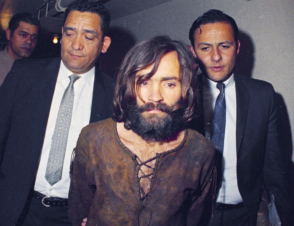 Charles Manson is escorted to his arraignment on conspiracy to commit murder charges in connection with the Sharon Tate murder case in Los Angeles in 1969. Photo: AP
