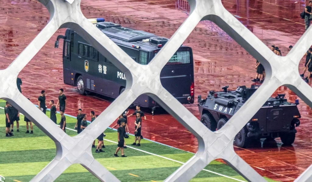 The exercise featured mock protesters dressed in black T-shirts. Photo: EPA-EFE The exercise featured mock protesters dressed in black T-shirts. Photo: EPA-EFE