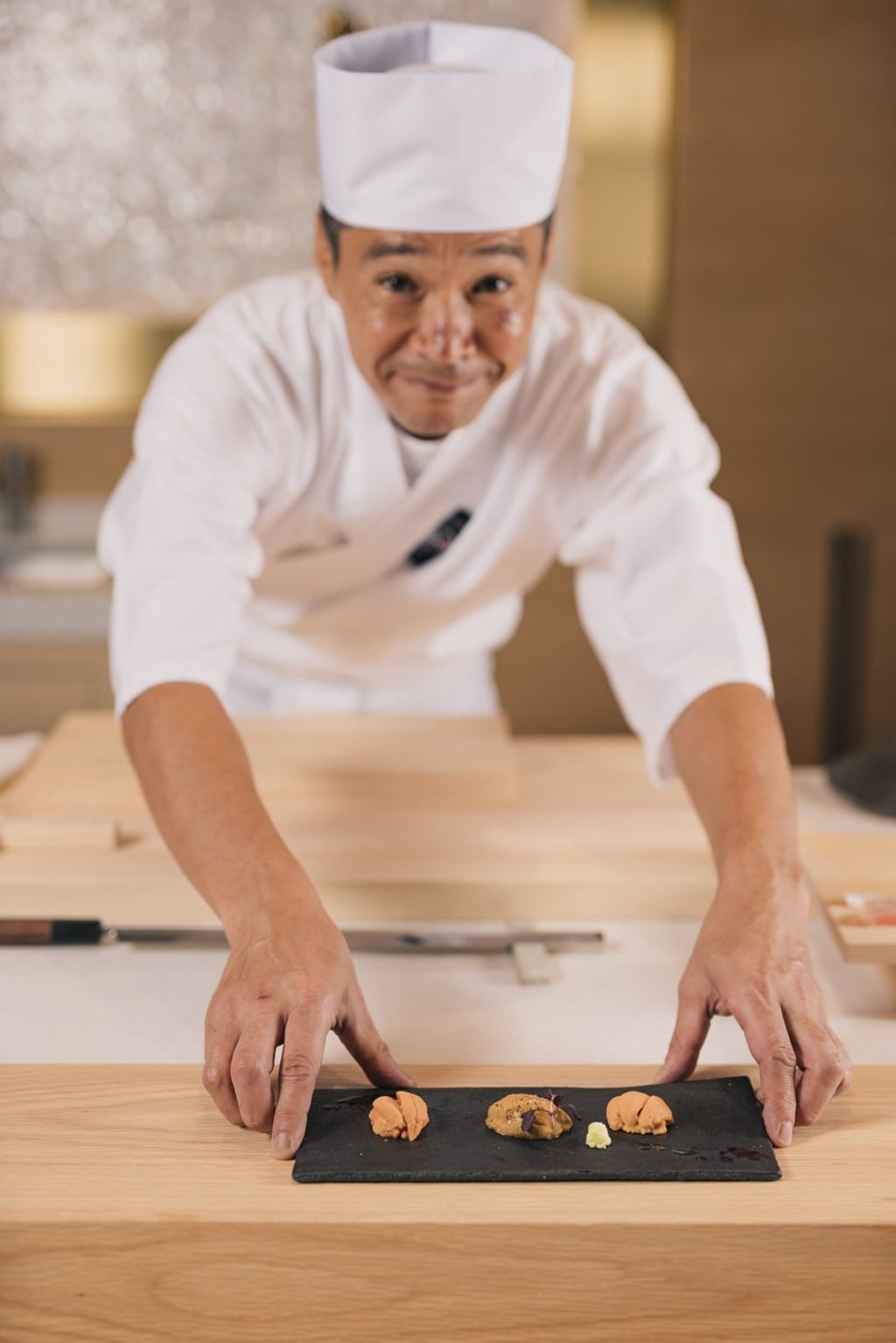 Chef Fumio Azumi serving uni done in three ways