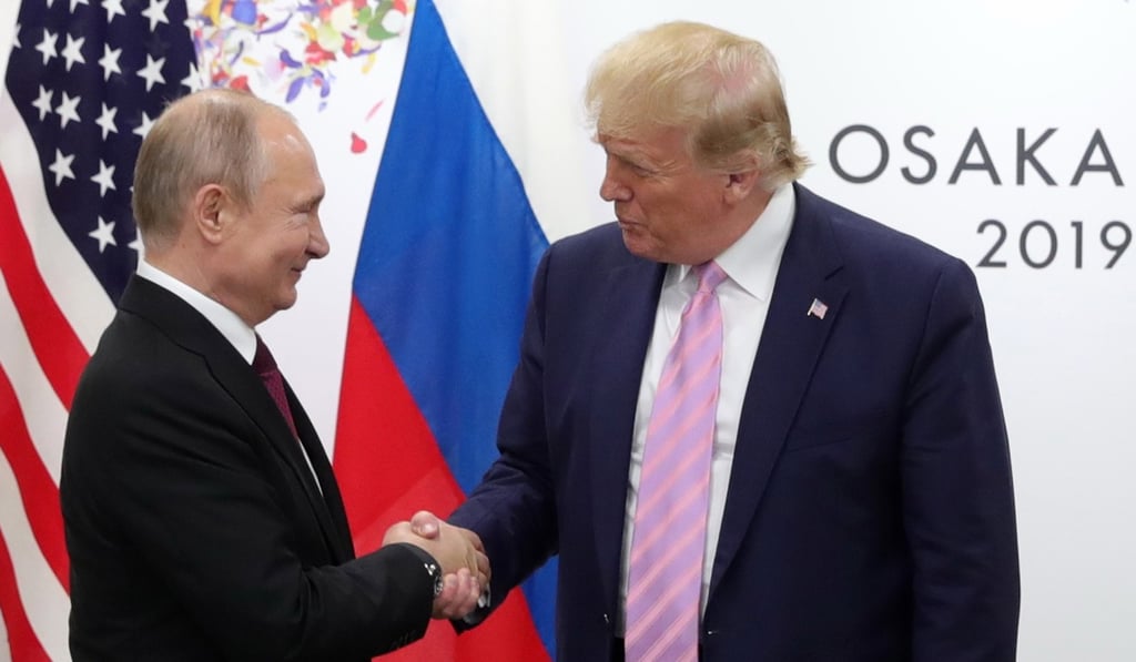 Russian President Vladimir Putin (left) shakes hands with US President Donald Trump on the sidelines of the G20 summit in Osaka in June. Photo: EPA-EFE