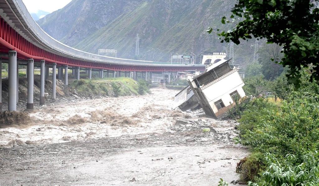 Torrential rain in Wenchuan county since Sunday turned to floods and mudslides, sweeping buildings away. Photo: Xinhua