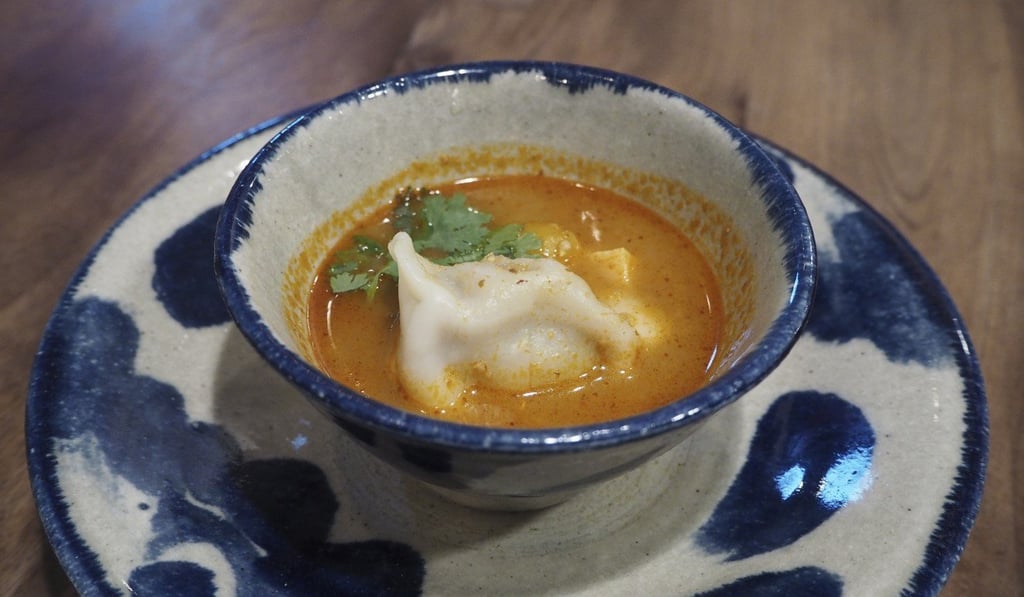 Penguin Shokudo’s tom yum soup dumpling with Iriomote pork. Photo: Janice Leung Hayes Penguin Shokudo’s tom yum soup dumpling with Iriomote pork. Photo: Janice Leung Hayes