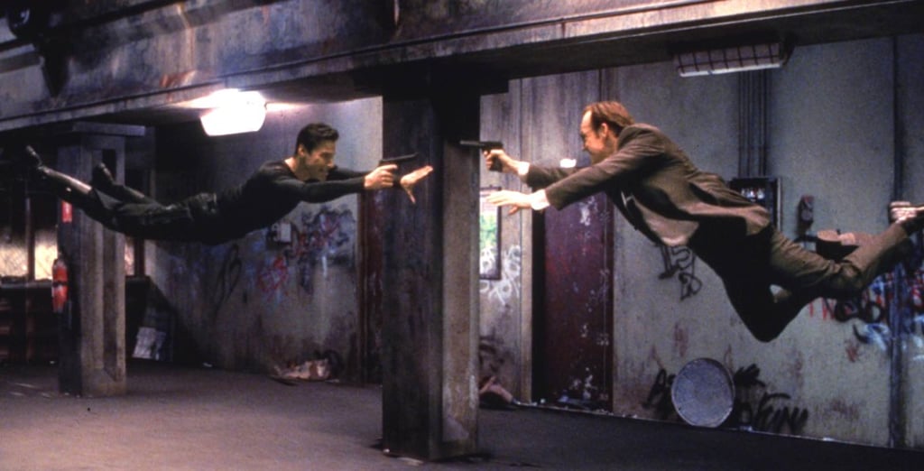 Keanu Reeves (left) and Hugo Weaving in a scene from The Matrix, the first film in the series, released in March 1999. Photo: Reuters/Warner Bros.